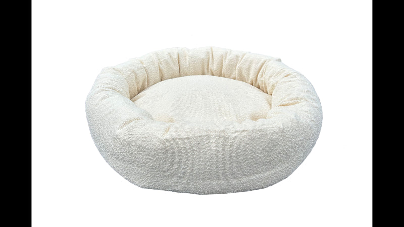 Round cream Boucle dog bed, 75cm diameter, ultra-soft fabric, cozy donut shape, easy to clean, ideal for small to medium dogs.