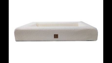 Cream Boucle Orthopedic Dog Bed, 100x65cm, with bolstered walls and waterproof inner for ultimate comfort and support.