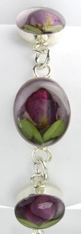 Sterling silver bracelet featuring a rose design with light purple accents, perfect for any occasion.