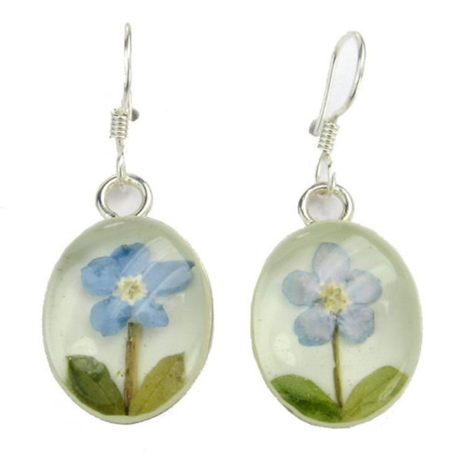 Sterling silver earrings featuring an oval design with a blue flower and white accents, perfect for any occasion.