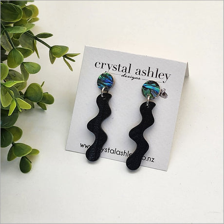 Lightweight drop earrings featuring black Wharare and colorful Paua shell, uniquely handcrafted for a stylish Kiwiana statement.