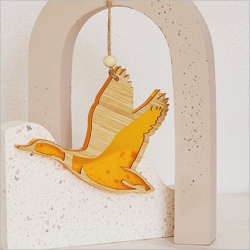 Vibrant orange satin acrylic duck ornament, laser-cut from bamboo, perfect for festive displays and gifts.