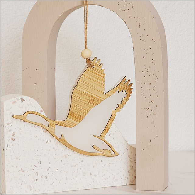 Whimsical white satin acrylic duck ornament, perfect for holiday decor, measuring 110mm x 90mm x 8mm, ready to hang.