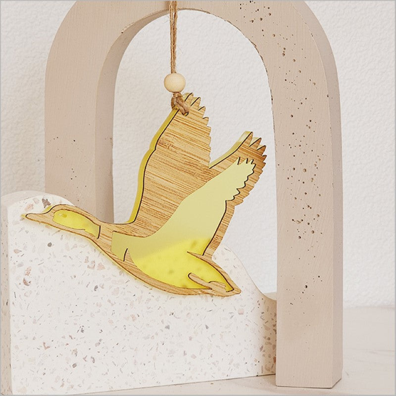 Decorative yellow satin acrylic duck ornament, perfect for kids' rooms and cheerful seasonal displays.