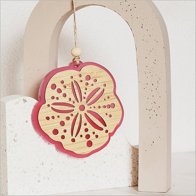 Elegant pink satin acrylic hanging ornament with laser-cut bamboo, perfect for home decor and gift giving.