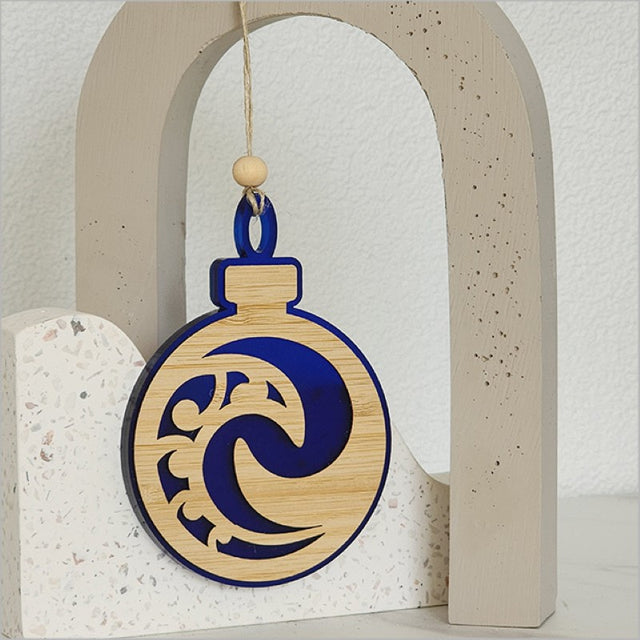 Blue satin acrylic Koru ornament, handcrafted, perfect for holiday decor or thoughtful gifts, measuring 80mm x 110mm.