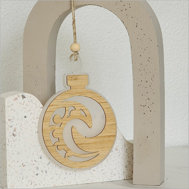 Elegant white acrylic Koru bauble ornament, 80mm x 110mm, symbolizing new beginnings, ready to hang for any occasion.