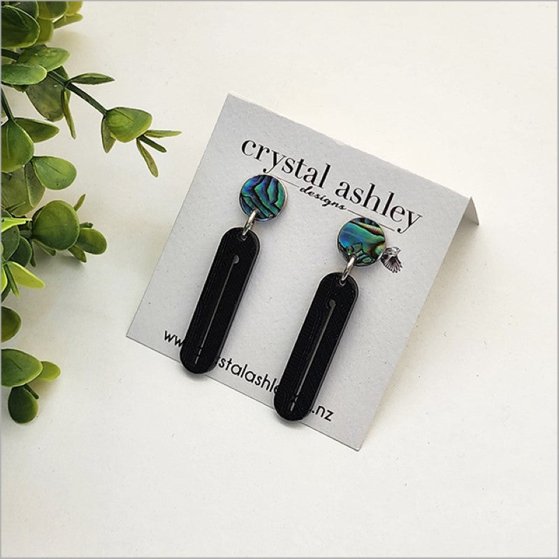 Long black wharare and paua drop earrings, lightweight, unique laser-cut design, hypoallergenic posts, Kiwiana-inspired accessory.