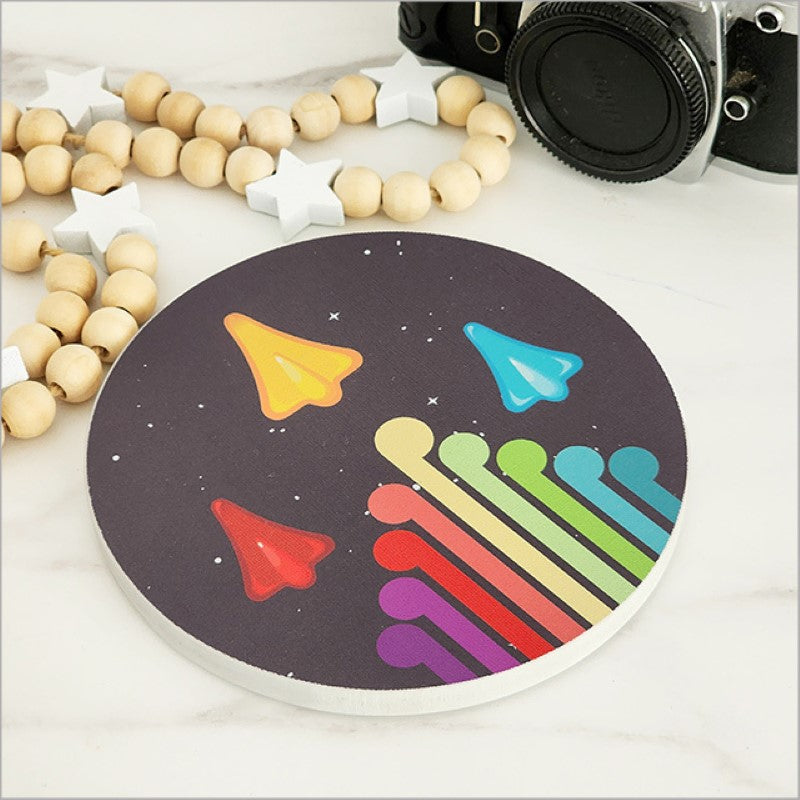 Small printed canvas circle featuring jet planes and Koru symbol, celebrating New Zealand culture and ready to hang.