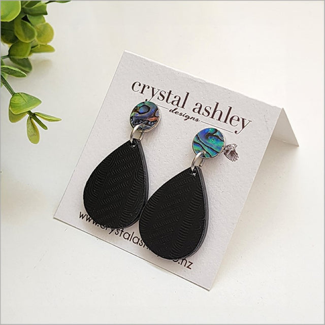 Teardrop earrings featuring Black Wharare wood and vibrant Paua shell in a lightweight, unique Kiwiana design.