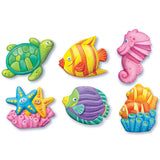 Craft kit for kids featuring moulds and vibrant paints to create sea creature fridge magnets and badges.