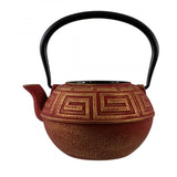 Elegant red and gold Avanti Majestic 1.2L cast iron teapot with stainless steel infuser for brewing loose leaf tea.