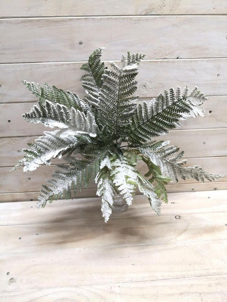 Lifelike snowy artificial fern bush ideal for elegant home decor and versatile arrangements, enhancing any indoor or outdoor space.