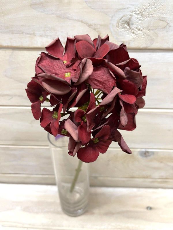 Vibrant red artificial hydrangea stem with a dry look, perfect for adding color and rustic charm to home decor.