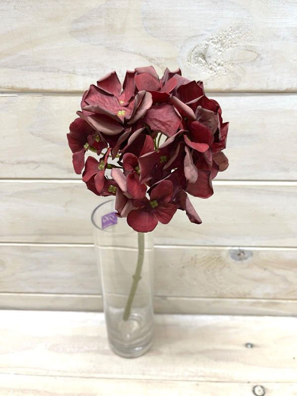 Vibrant red artificial hydrangea stem with a dry look, perfect for low-maintenance home decor and floral arrangements.