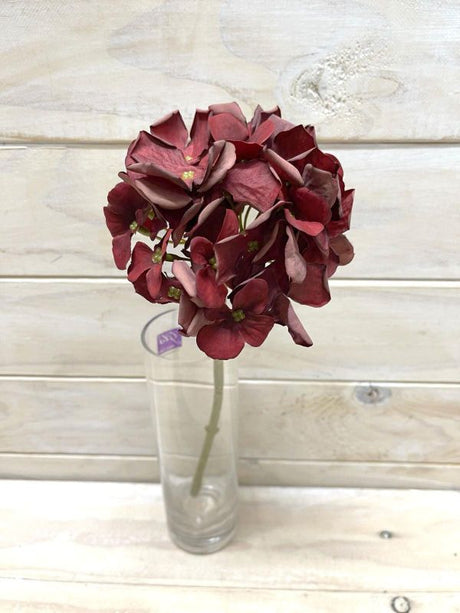 Vibrant red artificial hydrangea stem with a dry look, perfect for low-maintenance home decor and floral arrangements.