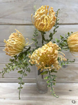 Bright yellow Artificial Dusty Warata Bush, lifelike faux plant perfect for vibrant home decor without maintenance.