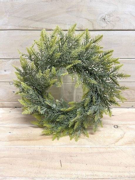 18" Light Green Pine artificial wreath, perfect for seasonal decor, suitable for any home's interior design.
