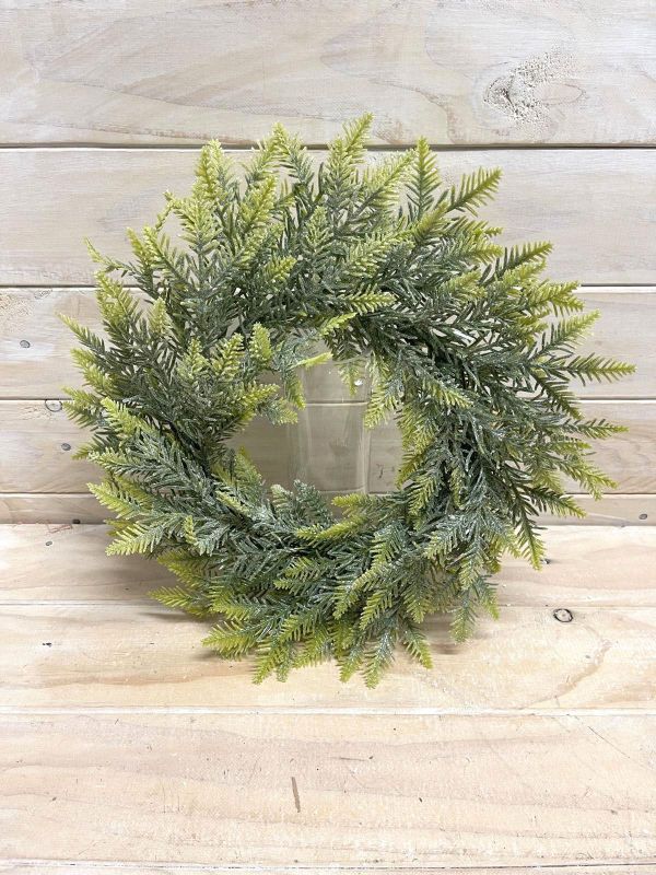 18" Light Green Pine artificial wreath, perfect for seasonal decor, suitable for any home's interior design.