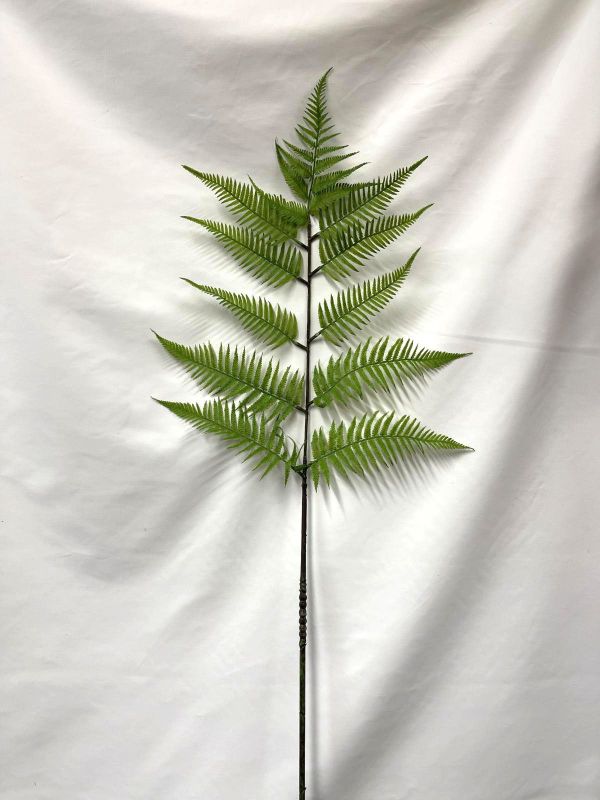 Lush green 50cm artificial fern spray adding elegant, low-maintenance greenery to any home decor or floral arrangement.