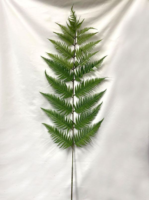 Lifelike 100cm green artificial fern spray, perfect for home decor or events, adding natural elegance to any space.
