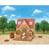 Sylvanian Families Bakery Shop set featuring 37 toy baked goods, bakery tools, and a Chocolate Rabbit Girl in costume.