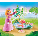 A princess gracefully approaches a sunny pond, accompanied by a dragonfly and a friendly flamingo in this enchanting playset.