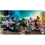 Playmobil Off-road Car with Jewel Thief playset featuring a police officer, jewel thief, motocross bike, and hollow tree.