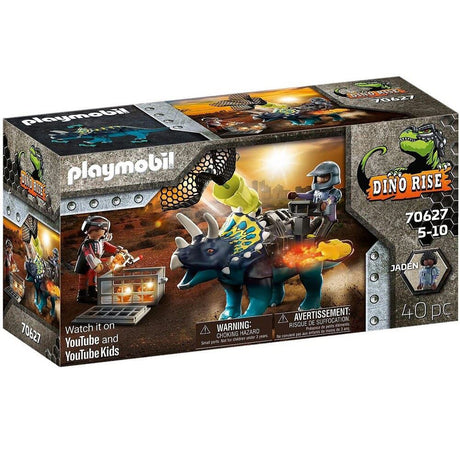 Playmobil Dino Rise set featuring armored Triceratops battling mini robots alongside figure Jaden, inspiring imaginative play.