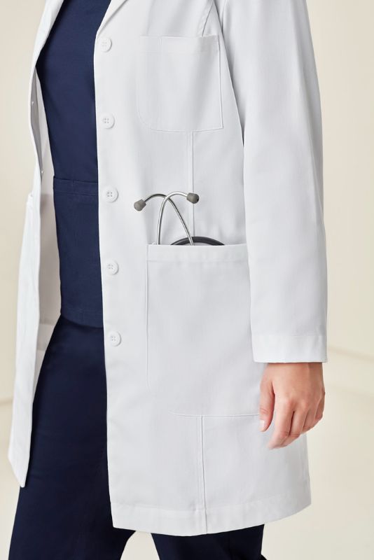 Stylish white long line lab coat for women, featuring Teflon stain resistance and multiple pockets for functionality.