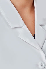 Stylish white women's long line lab coat with tailored fit, multiple pockets, and stain-resistant fabric by Biz Collection.