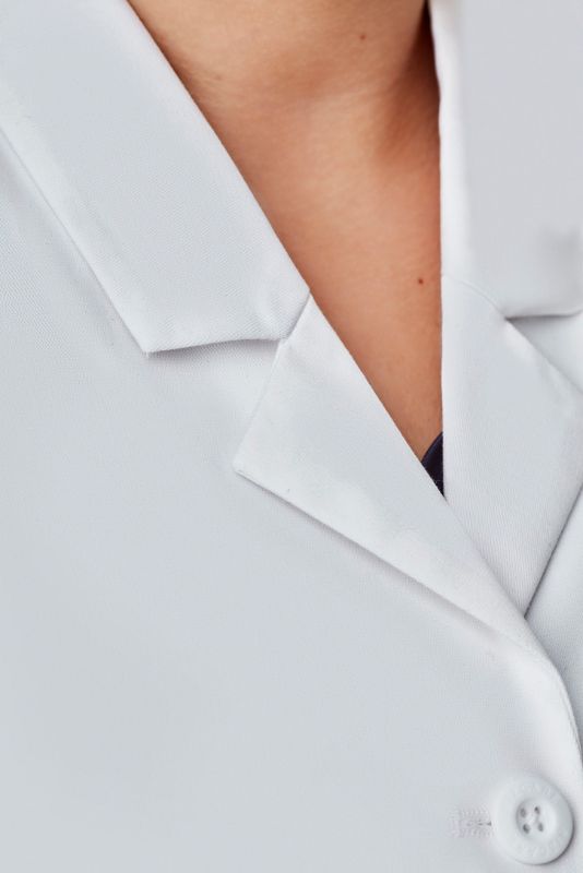 Women's Hope Long Line Lab Coat in white, featuring a tailored fit, multiple pockets, and Teflon stain release fabric.