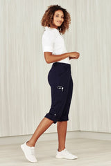 Navy women's cargo pants in size 4, featuring multiple pockets, a comfort waistband, and roll-up legs for versatility.