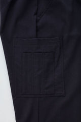 Men's charcoal cargo pants with comfort waistband, multiple pockets, and roll-up legs for flexible workwear. Size 107.