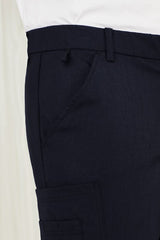 Navy men's cargo pants with comfort waistband, multiple pockets, and roll-up leg feature for durability and flexibility.