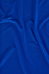 Electric blue short sleeve jersey top for women, offering comfort and style for work and casual outfits. Size S.