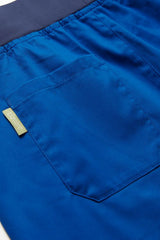 Women's Riley Slim Leg Jogger Scrub Pant in Electric Blue, size XXS, featuring breathable fabric and antibacterial stretch panels.