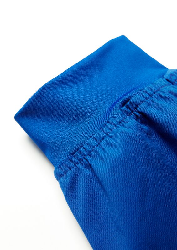 Men's electric blue jogger scrub pants with slim leg design, knit waistband, and antibacterial treatment for comfort and hygiene.