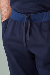 Men's Riley Slim Leg Jogger Scrub Pant in Midnight Navy, featuring a comfortable waistband and antibacterial fabric for healthcare professionals.