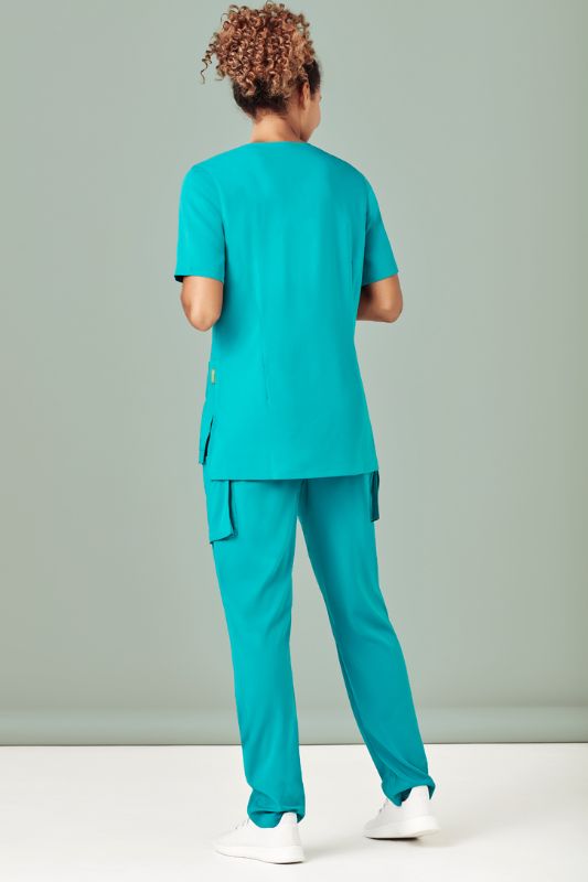 Women’s teal scrub pants with tapered leg, multiple pockets, moisture-wicking fabric, and easy-care maintenance. Size XXS.