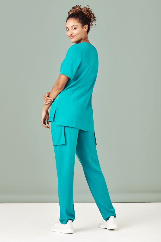 Teal women's scrub pant in size XXS with tapered leg, multiple pockets, and moisture-wicking fabric for comfort and style.