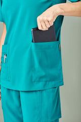 Teal women's scrub pants with straight leg design, multiple cargo pockets, and roll-up leg feature for convenience and comfort.