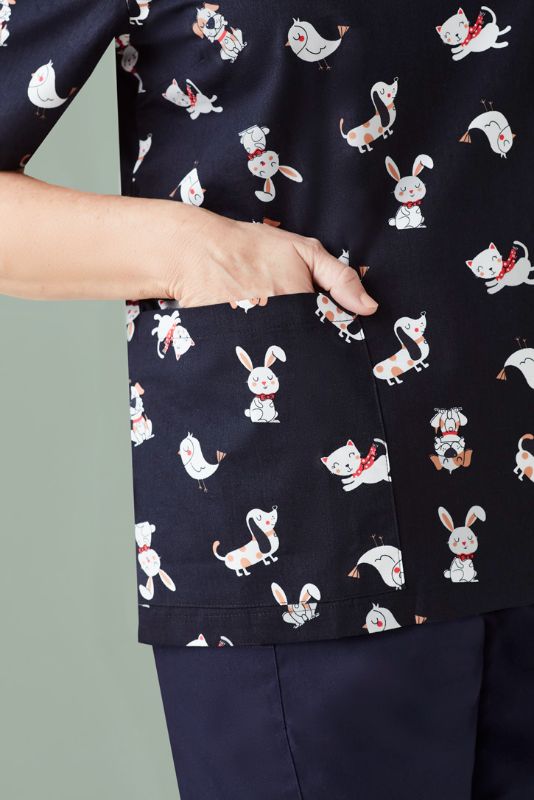 Midnight navy women's scrub top in XXS featuring a fun print, ideal for veterinarians and educators, combining style and comfort.