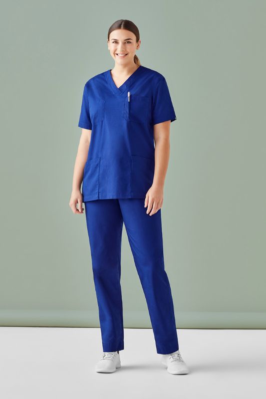 Unisex dark blue reversible scrub top from Biz Collection, featuring pockets and made from durable polyester-cotton blend.