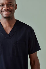 Unisex Hartwell reversible scrub top in Midnight Navy (XXS) featuring pockets, durable fabric, and industrial laundry friendly.