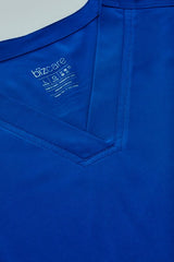 Electric Blue women's scrub top featuring a V-neck, multiple pockets, and moisture-wicking fabric in size Small.