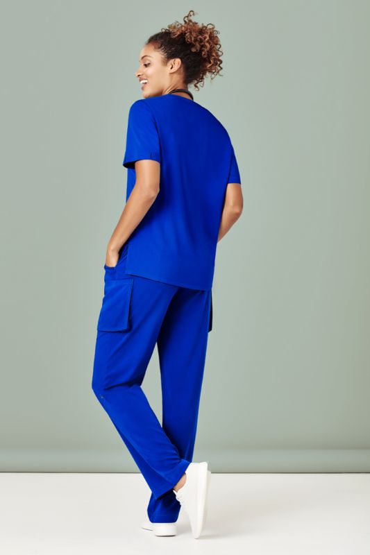 Electric Blue women's scrub top with V-neck, pockets, and a moisture-wicking fabric, tailored for healthcare professionals.