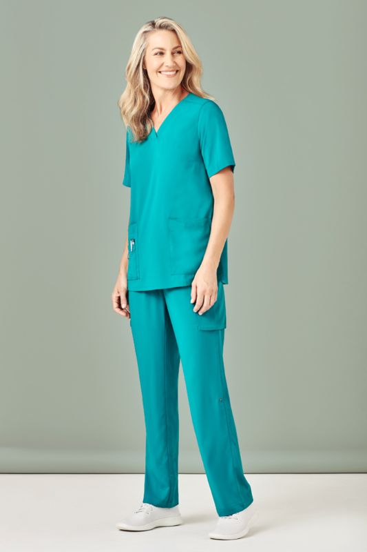 Women's teal V-neck scrub top by Biz Collection, featuring pockets, utility loops, and a comfortable fit in size S.