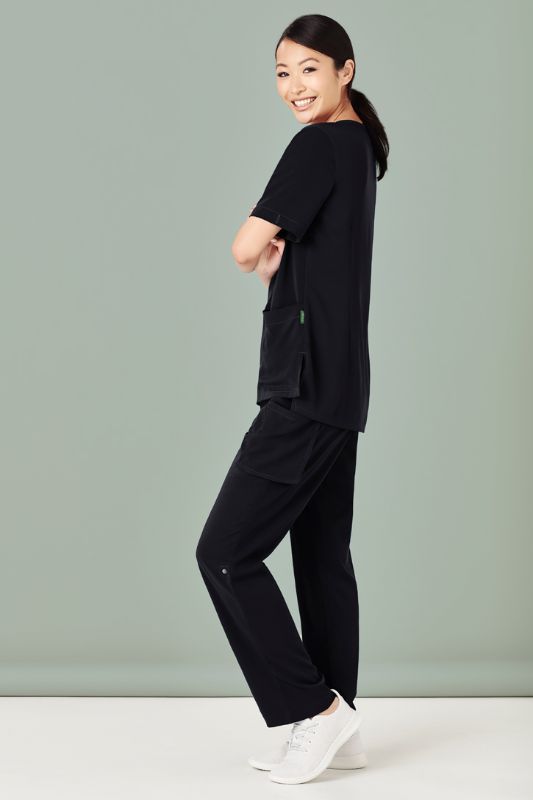 Women's black round neck scrub top in size M, featuring tailored fit, multiple pockets, and soft, easy-care fabric.