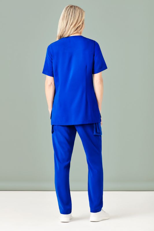 Vibrant electric blue women's scrub top with round neck, tailored fit, multiple pockets, and wicking fabric for comfort.